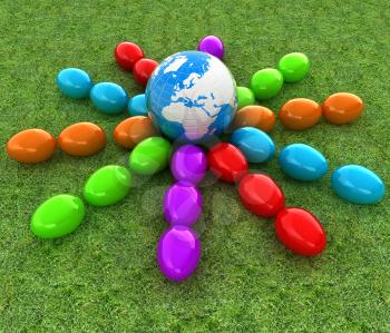 Colored Easter eggs around Earth on a green grass