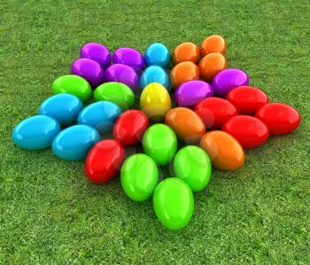 Colored Easter eggs as a flower on a green grass