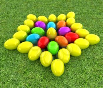 Colored Easter eggs as a flower on a green grass