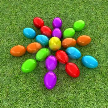 Colored Easter eggs as a flower on a green grass