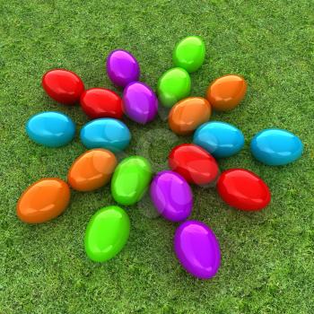 Colored Easter eggs as a flower on a green grass