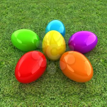 Colored Easter eggs as a flower on a green grass