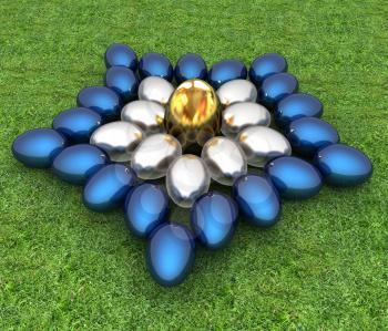 Blue metallic, metall and Gold Easter eggs as a flower on a green grass