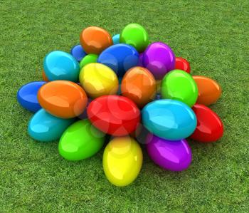 Colored Easter eggs on a green grass