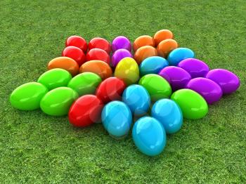 Colored Easter eggs as a flower on a green grass