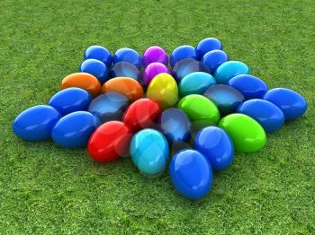 Colored Easter eggs as a flower on a green grass