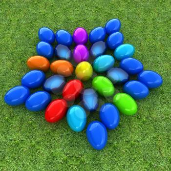 Colored Easter eggs as a flower on a green grass