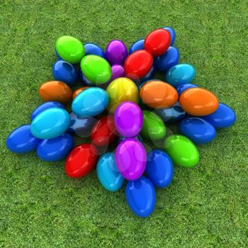 Colored Easter eggs as a flower on a green grass