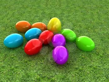 Colored Easter eggs as a flower on a green grass