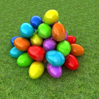 Colored Easter eggs on a green grass