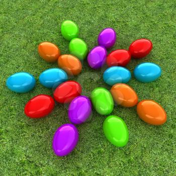 Colored Easter eggs as a flower on a green grass