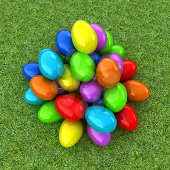 Colored Easter eggs on a green grass