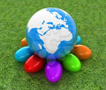 Earth on Colored Easter eggs on a green grass