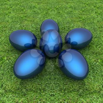 Metallic blue Easter eggs as a flower on a green grass