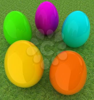 Colored Easter eggs on a green grass