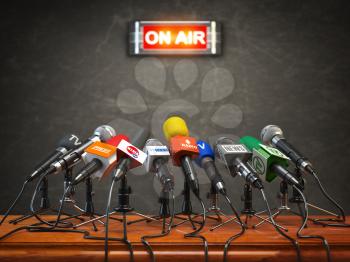 Press conference or interview on air.  Microphones of different mass media, radio, tv and press prepared for conference meeting. 3d illustration