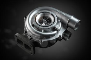 Car turbocharger on black background. Auto part turbo engine technology concept. 3d illustration