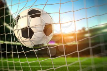 Goal. Soccer football ball scores a goal on the net. 3d illustration