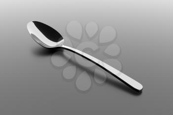 Silver spoon on a table. Fine cutlery on grey background. Single fork on a table. Silverware with shadow. 3D illustration.