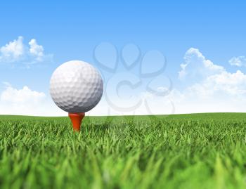 Golf ball on tee in grass