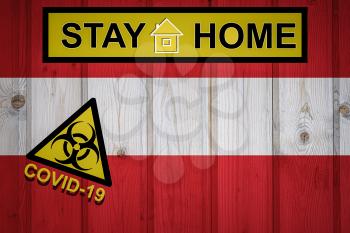 Flag of the Austria in original proportions. Quarantine and isolation - Stay at home. flag with biohazard symbol and inscription COVID-19.