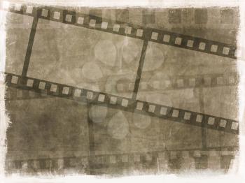 Dirty grunge background with image of film strips