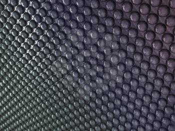 Royalty Free Clipart Image of Abstract Carbon Fiber With Pimples