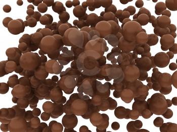 Brown chocolate orbs or balls isolated over whtie background