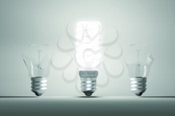 Idea and mistake or failure: illuminated bulb among two broken ones. Large resolution