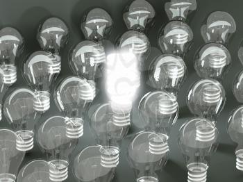 New idea or invention: illuminated efficient bulb among old ones. Large resolution