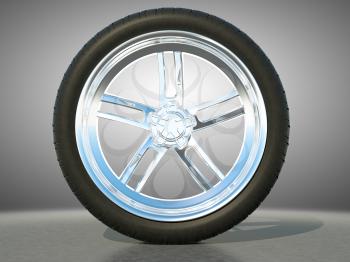 Automotive alloy wheel with tire and studio light background