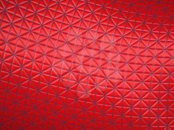 Red fabric with triangle stitched pattern. Useful as background
