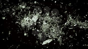 Pieces of shattered or cracked glass on black. Large resolution