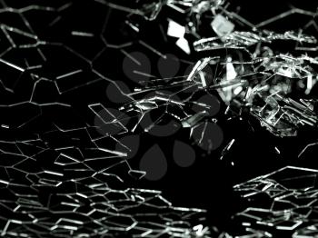 Destructed or broken glass pieces on black background. shallow DOF