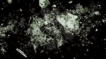 Pieces of splitted or broken glass on black. Large resolution