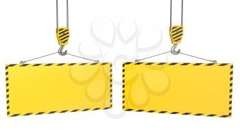 Two crane hooks with blank yellow plates, isolated on white background