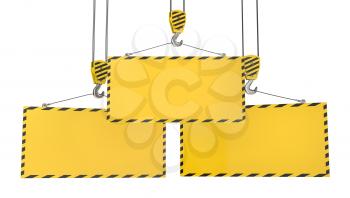 Three crane hooks with blank yellow plates, isolated on white background