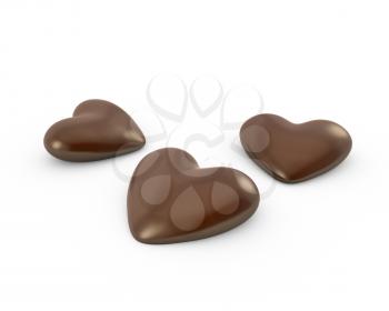 Thre heart shaped chocolate candies, isolated on white background