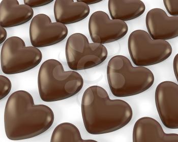 Many heart shaped chocolate candies, isolated on white background