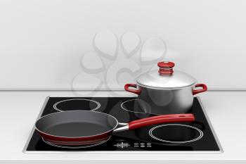 Pot and frying pan at the induction stove