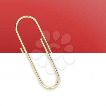 Close up of gold paper clip holding a blank paper sheet