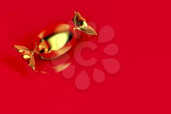 Gold wrapped candy on shiny red background