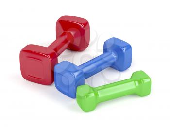 Three dumbbells with different sizes and colors on white background