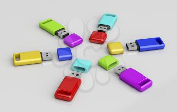 Group of usb memory sticks with different colors on shiny grey background