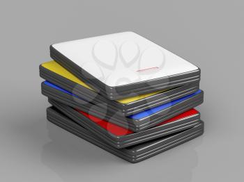 Stack with portable hard drives with different colors on shiny gray background 