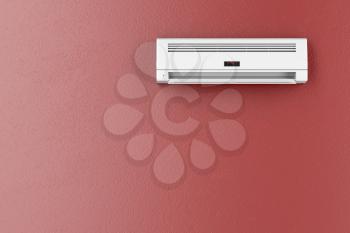 Split-system air conditioner on red wall 
