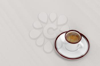 Hot espresso coffee on wooden table, top view 