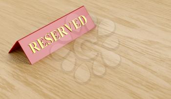 Reserved sign on wooden table 