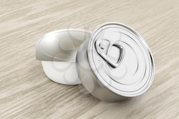 Tin cans for pate, cheese, butter or other food, on wood background