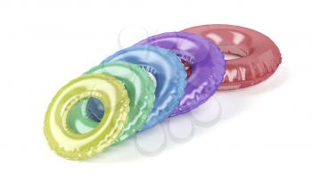 Colorful swim rings on white background